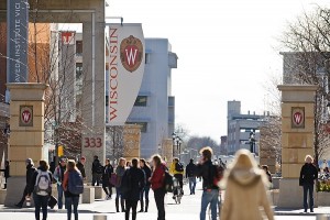 Pedestrians walk past the University Square complex and Student Services Tower at 333 East Campus Mall which houses Financial Services.