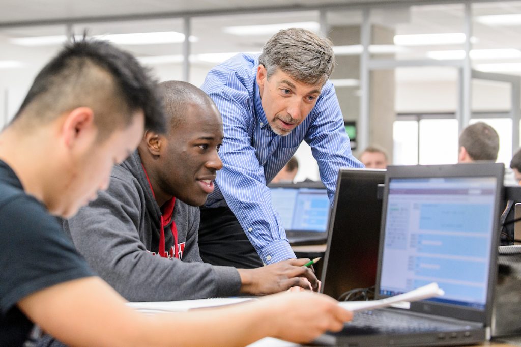 Professor Barry Van Veen works with students