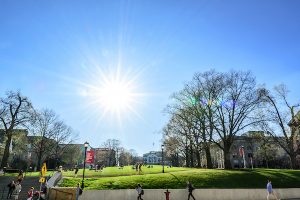 Students enjoy a warm spring day on Bascom Hill.