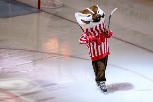 UW mascot Bucky Badger skates on the ice at the Kohl Center during a men's UW Badgers hockey game against Michigan.