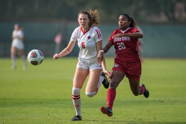 UW soccer player Grace Douglas fights for possession of the ball against Stanford