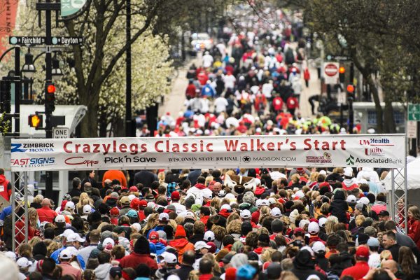 Thousands of people are lined up at the start of the race to walk the Crazylegs Classic in downtown Madison