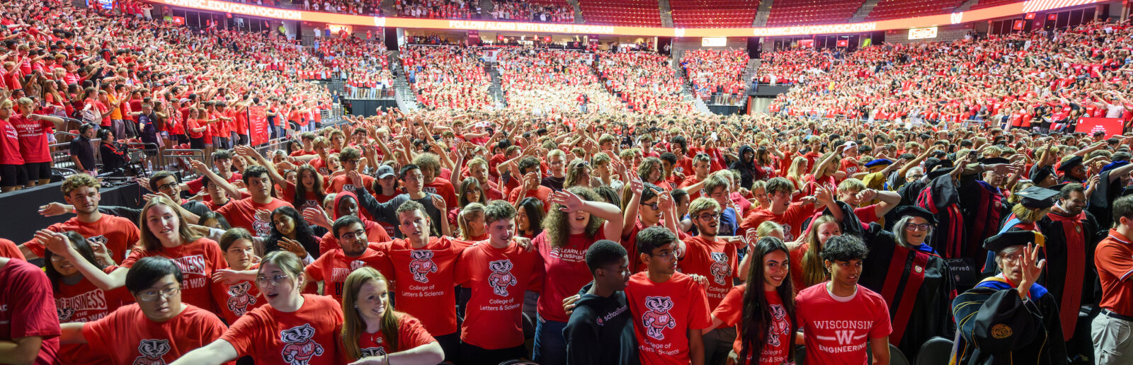 Students sway and sing to "Varsity" during New Student Convocation 