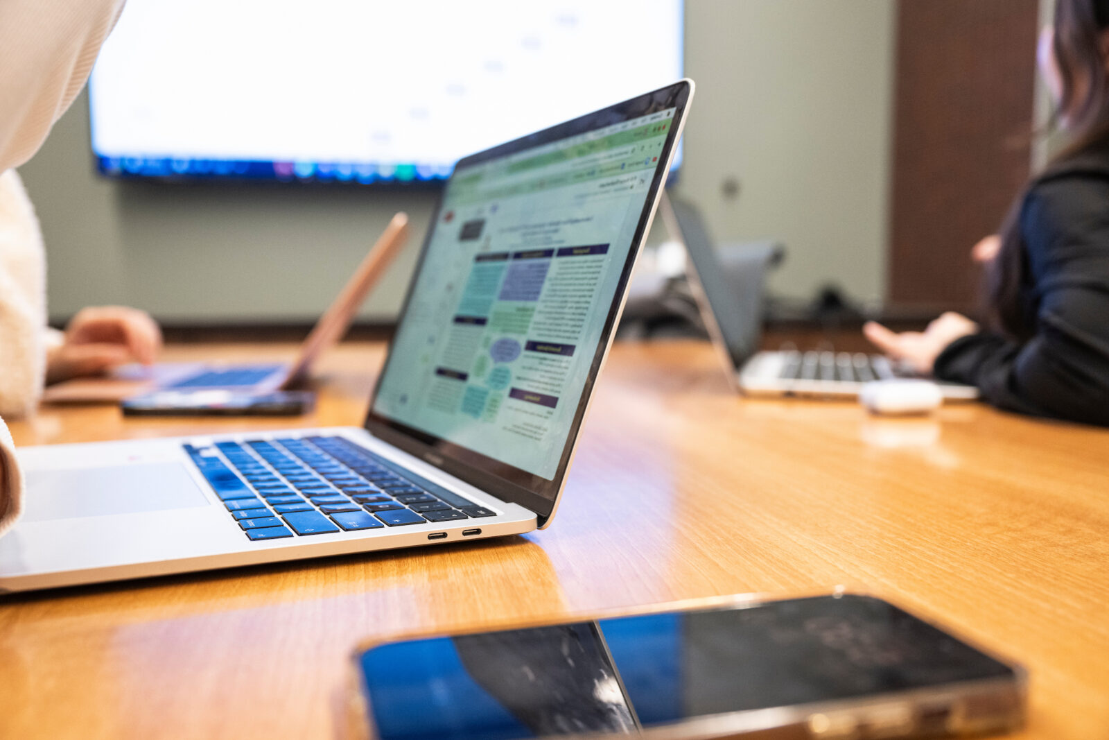 A smartphone and laptop computer are pictured