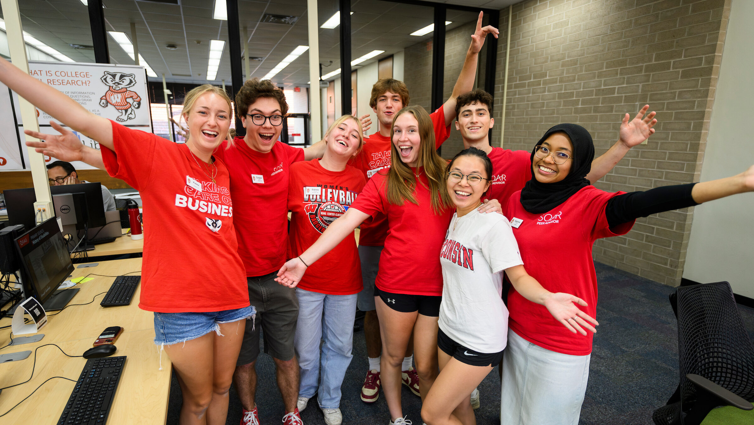Student Orientation, Advising and Registration (SOAR) peer advisors gather for a group portrait at College Library