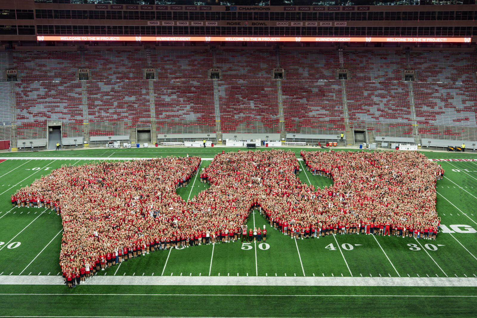 The freshman class forms an iconic motion W at midfield in Camp Randall Stadium at the University of Wisconsin–Madison during the W Project on Aug. 27, 2025.