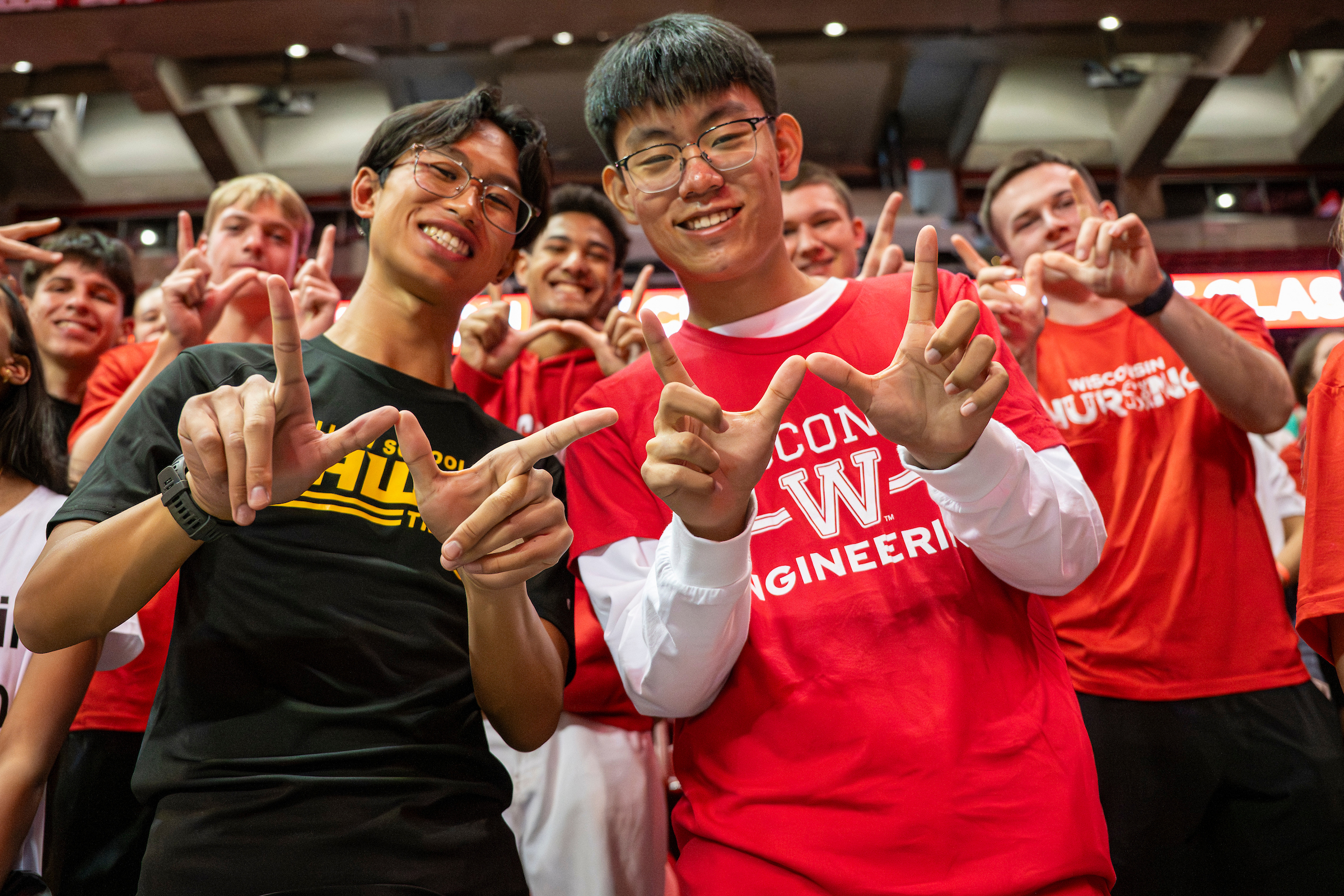 Students show the Badger Pride W at Convocation. 