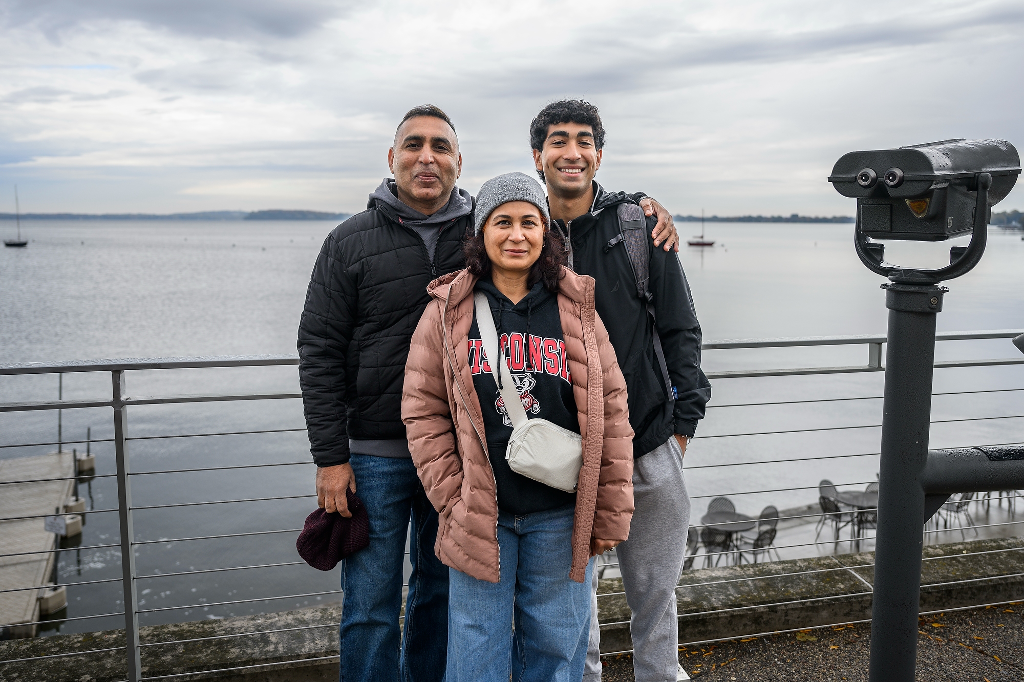 A family poses by the lake 