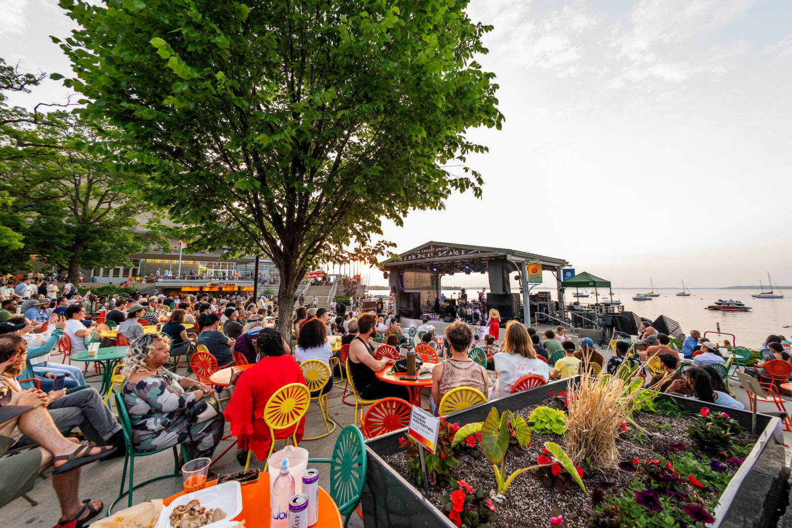 Families enjoy a lakefront sunset at Memorial Union Terrace.