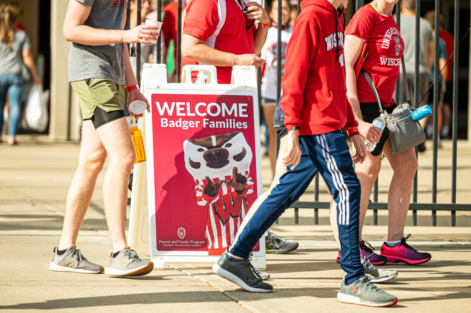 Families enter Camp Randall Stadium for a chance to walk out on the playing field and take photos at the University of Wisconsin-Madison during Family Weekend 