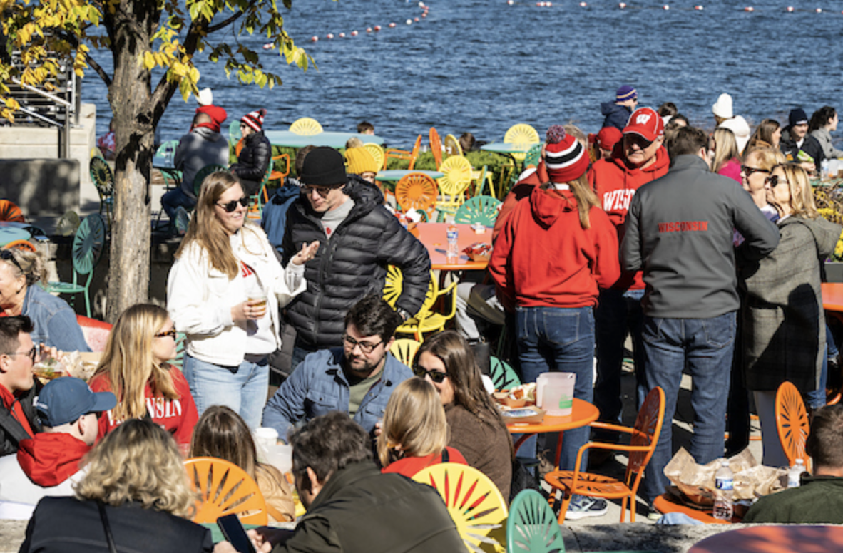 Families gather at Memorial Union, featuring the iconic sunburst chairs. 
